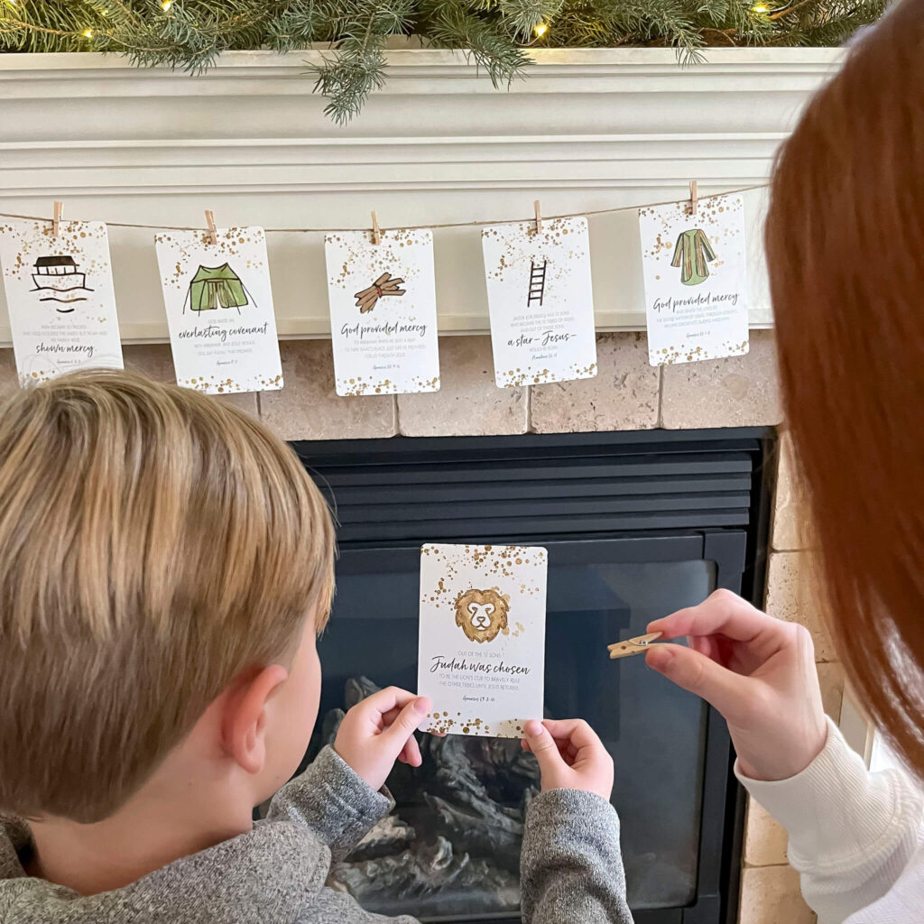 Advent Christmas Cards, Jesse Tree cards hanging by string above the fireplace